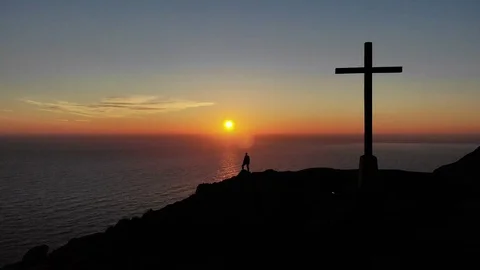 Sunrise silhouette fly backwards cross reveal Stock Footage 101657595