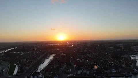 Sunrise silhouette pullback over Harlingen toward the sea Stock Footage 331841177