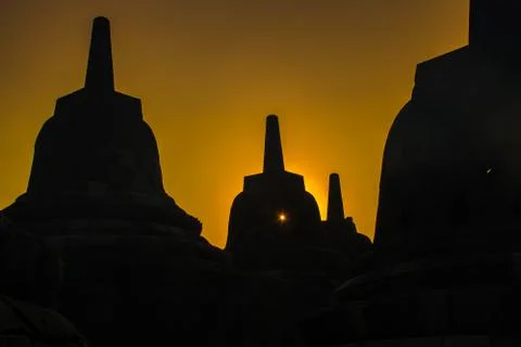 Sunrise silhouettes of Buddhist temple complex Borobudur, Yogyakarta, Jawa, Stock Photos
