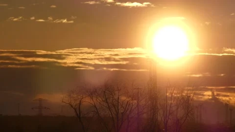 Sunrise sky, real time - 2/4 - power poles, wind turbines, trees, flying birds Stock Footage 151900996