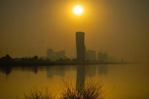 Sunrise Sky view background behind capital gate tower of Abu Dhabi, Skyscrape Stock Photos