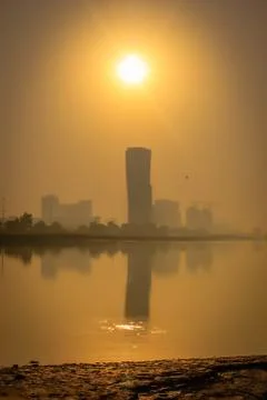 Sunrise Sky view background behind capital gate tower of Abu Dhabi, Skyscrape Stock Photos