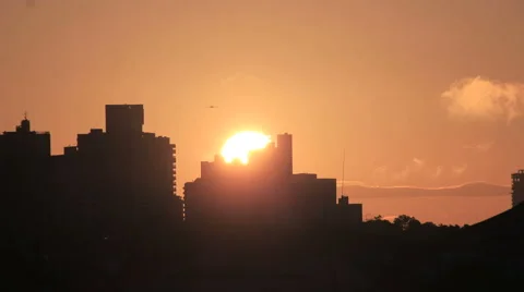 Sunrise Skyline. Silhouette Buildings And Golden Sun Stock Footage