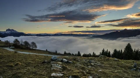 Sunrise Slider Motion Timelapse over Sea of Clouds and Mountain Peaks Vídeos de archivo 345045799