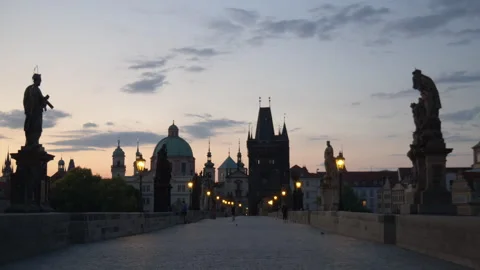 Sunrise on the St Charles Bridge as Old Town Prague wakes up Stock-Footage 284809976