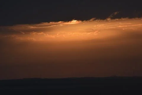 Sunrise in the summer with golden clouds. Stock Photos