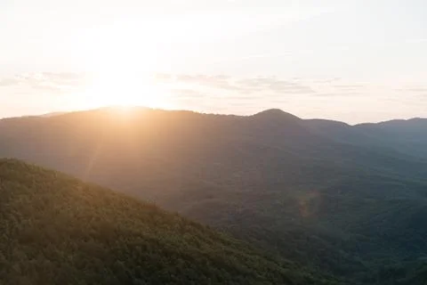 Sunrise in summer mountains. Stock Photos