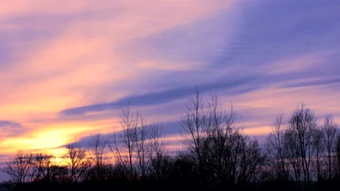 Sunrise sun over trees silhouettes - time lapse clouds - sky background - 30 fps Stock Footage 147968443