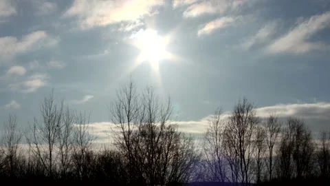 Sunrise sun over trees silhouettes - time lapse clouds - sky background - 25 fps Stock Footage 148193271