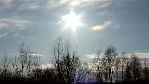 Sunrise sun over trees silhouettes - time lapse clouds - sky background - 30 fps Stock Footage 148193940