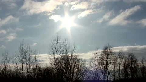 Sunrise sun over trees silhouettes - time lapse clouds - sky background - 60 fps Stock Footage 148208862