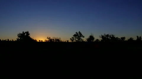 Sunrise. The sun's rays are scattered in the morning fog. Timelapse. Stock Footage 142604865