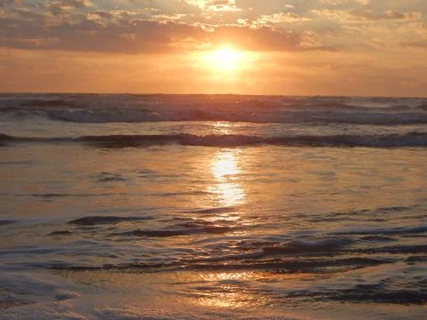 SUNRISE, SUNSET ON THE BEACH Stock Photos