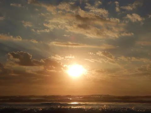 SUNRISE, SUNSET ON THE BEACH Stock Photos