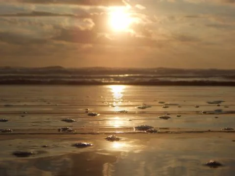 SUNRISE, SUNSET ON THE BEACH Stock Photos