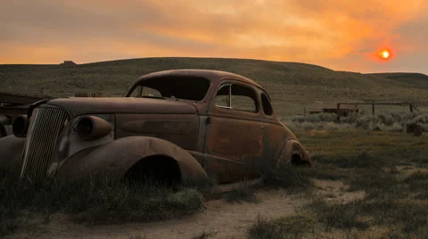 Sunrise Sunset Over Deserted Car in Abandoned Ghost Town Stock Footage