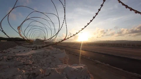 Sunrise Through Barbed Wire at Mogadishu Somalia Airport Stock Footage 72682467