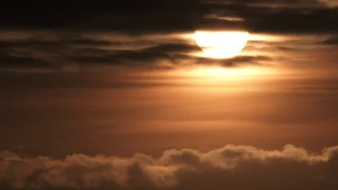 Sunrise Through Cloud Layers On Warm Sky Timelapse Video stock 122383060