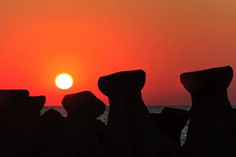 Sunrise through concrete slabs Stock Photos