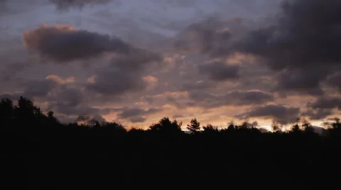 Sunrise through fast moving clouds  Stock-Footage 57933557