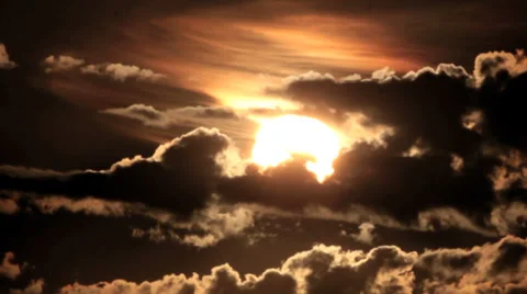 Sunrise Through Flowing Dark Clouds - timelapse Stock Footage