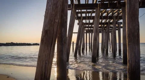 Sunrise through a pier Stock Footage 46067772