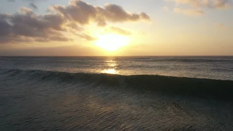 Sunrise through waves Stock Footage 139193733