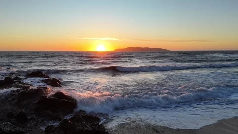 Sunrise through the waves Stock Footage 306763873