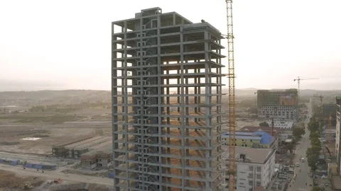 Sunrise time Construction Crane and building process 4K Drone shot 스톡 동영상 119368699