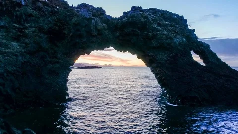 Sunrise Time Lapse at Arnarstapi Arch in Iceland in 4k Stock Footage 90427327