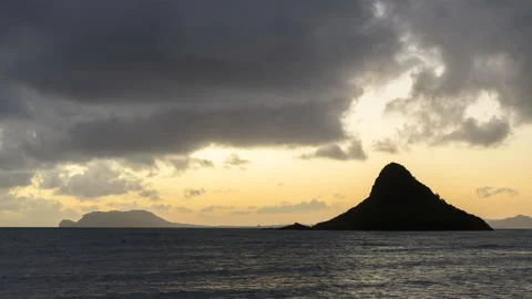 Sunrise time lapse of "The Hat" off the coast of Hawaii - 8K Stock Footage 220885428