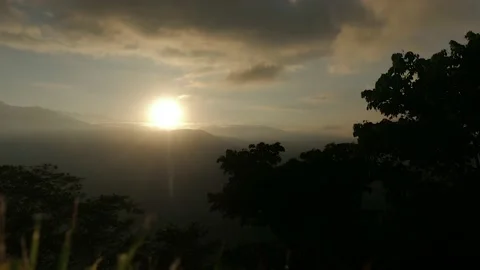 Sunrise time lapse of a mountain volcano tropical jungle forest with Stock Footage 142980830