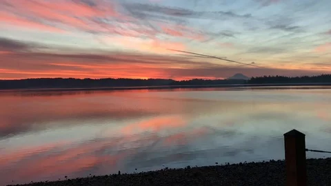 SUNRISE TIME-LAPSE OF MT RAINIER AND CLOUDS_DYES INLET_WA_1080P Stock Footage 100566849