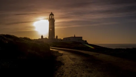 A sunrise time lapse at the Mull of Galloway lighthouse, Scotland Video stock 90754239