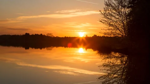Sunrise time lapse - over the still waters of a lake - 25FPS - 4k timelapse Stock Footage 37596759