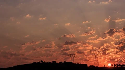 Sunrise time lapse with pylon and mountain with trees silhouette Stock Footage 131367404