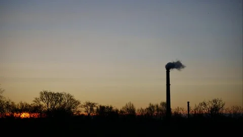 Sunrise Time Lapse Sky and moving clouds Power Plant pipe with smoke Latvia 4K Stock Footage