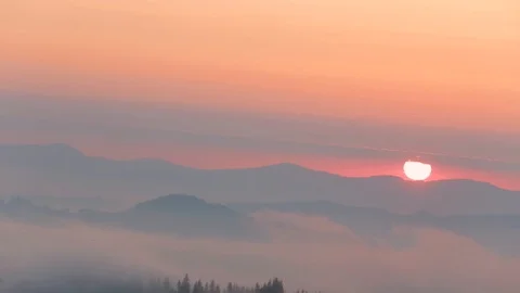 Sunrise time lapse on top of mountains, with beautiful clouds Stock Footage 123778142
