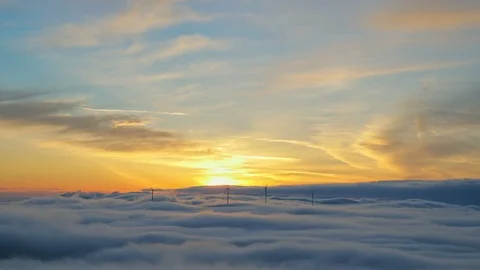 Sunrise Time lapse with Wind Turbines above mountain fog. Renewable energy Video stock 98237446