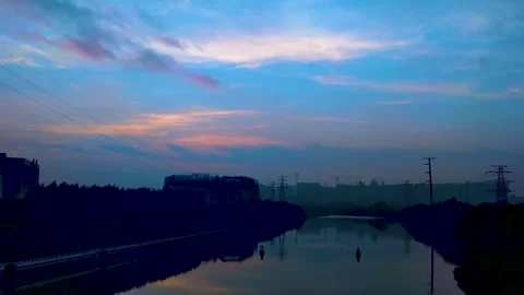 Sunrise Timelapse Over A Calm River And Industrial Landscape At Dawn Stock Footage 342252592