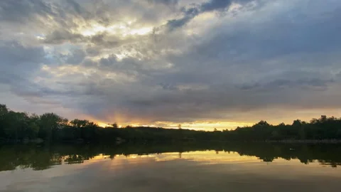 Sunrise timelapse over a pond in the Czech Republic, with sunbeams breaking.. Stock Footage 345070444