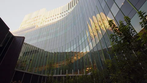 Sunrise timelapse in reflective windows, Calgary Cancer Centre building Stock Footage 315693158