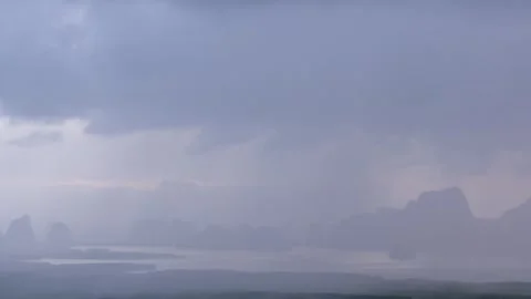Sunrise timelapse at Samet Nangshe viewpoint with rain clouds, glowing sun and Stock Footage 320163118