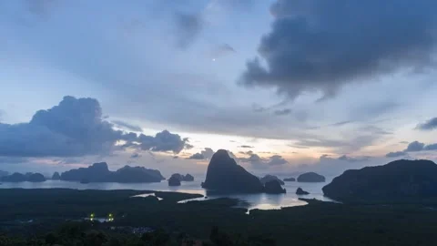 Sunrise timelapse at Samet Nangshe viewpoint with rain clouds, glowing sun and Stock-Footage 320163409