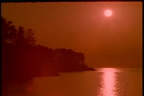 Sunrise timelapse at sea shore diffused orange Stock Footage 183105678