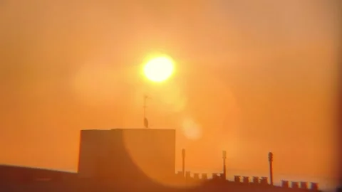 Sunrise Timelapse Sun Emerging from Behind Building Moving Diagonally Up Video stock 331195398