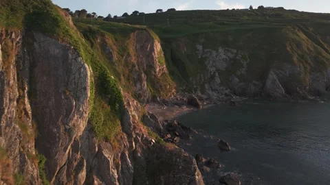 Sunrise at Tiny Hidden Beach in. Howth08 - 4K Cinematic Drone Footage - Stock Footage 284326396