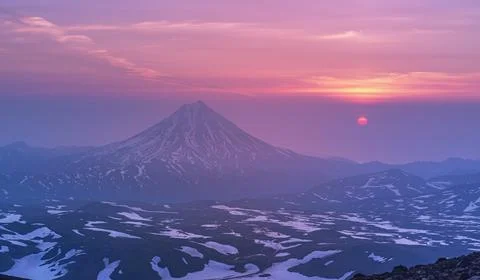 Sunrise from the top of the Gorely volcano and view to the Vilyuchinsky volca Stock Photos
