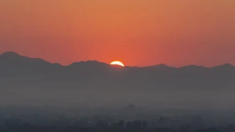Sunrise from the top of mountain over the clouds Stock Footage 98989514