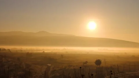 Sunrise in the valley hills in the backdrop Stock Footage 238629218